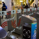 A sign sits on a ticket gate equipped with a facial recognition fare payment system - Face Pay - at Turgenevskaya metro station in Moscow on September 23, 2021.